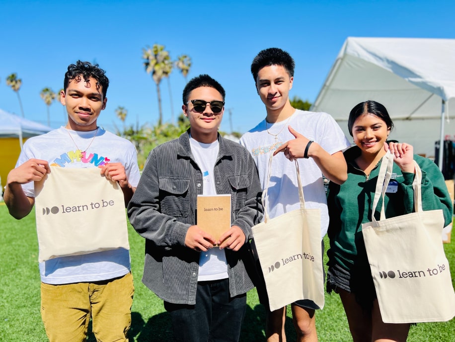 Learn to Be volunteers at a community event