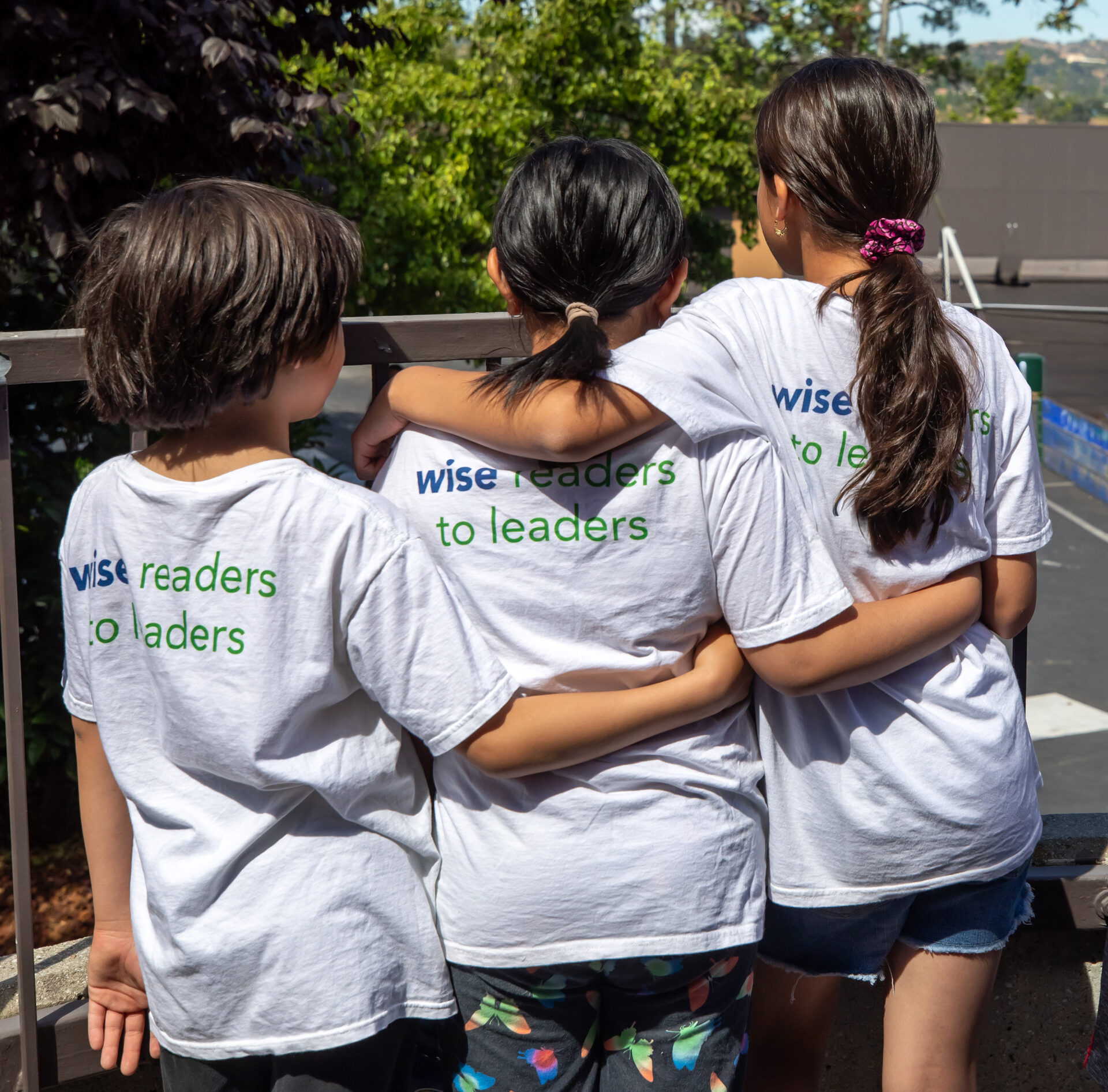Students wearing Wise Readers to Leaders shirts